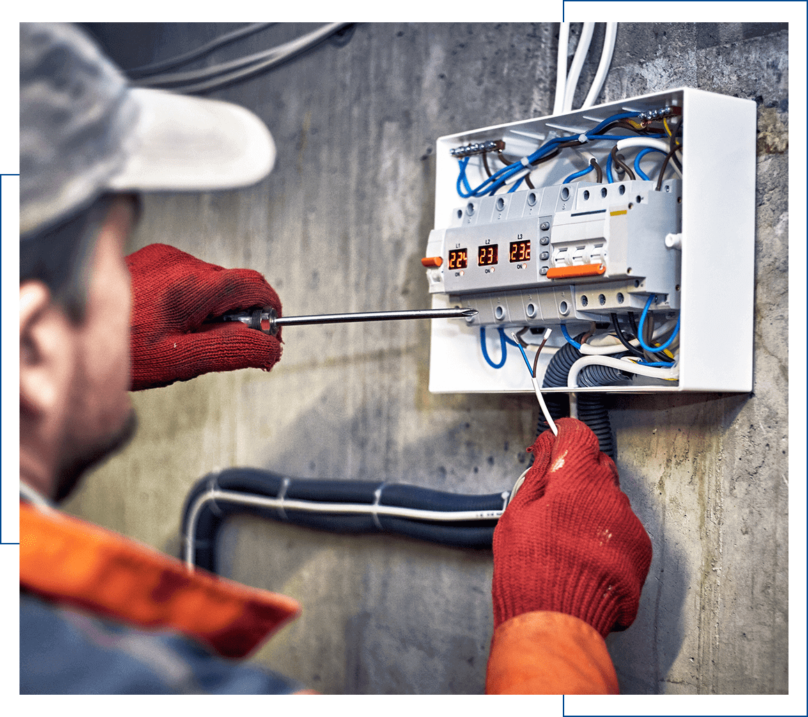 Gloved technician wiring a residential breaker box